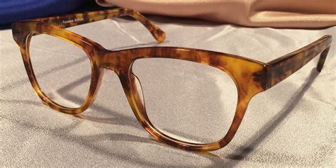 rectangular tortoise shell eyeglass frames.